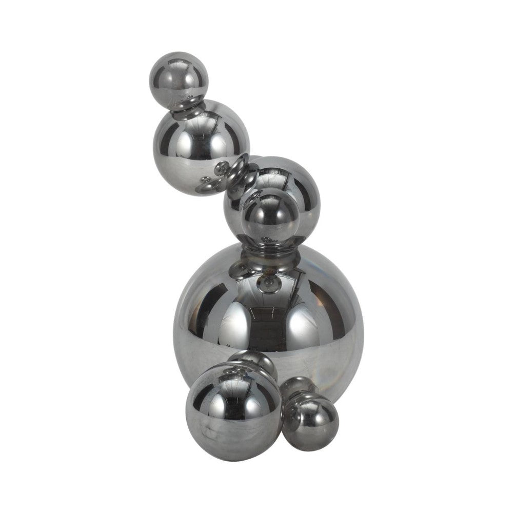 Stacked reflective silver spheres on white background.