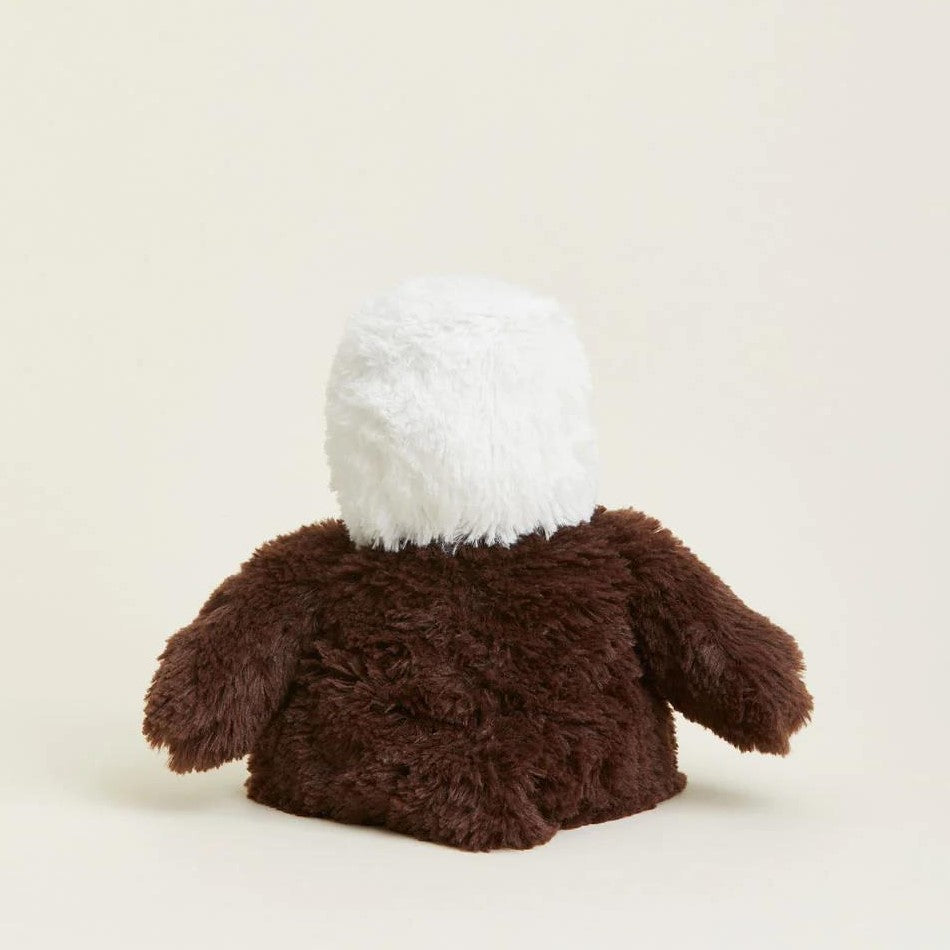 Fluffy stuffed toy with white head and brown body.