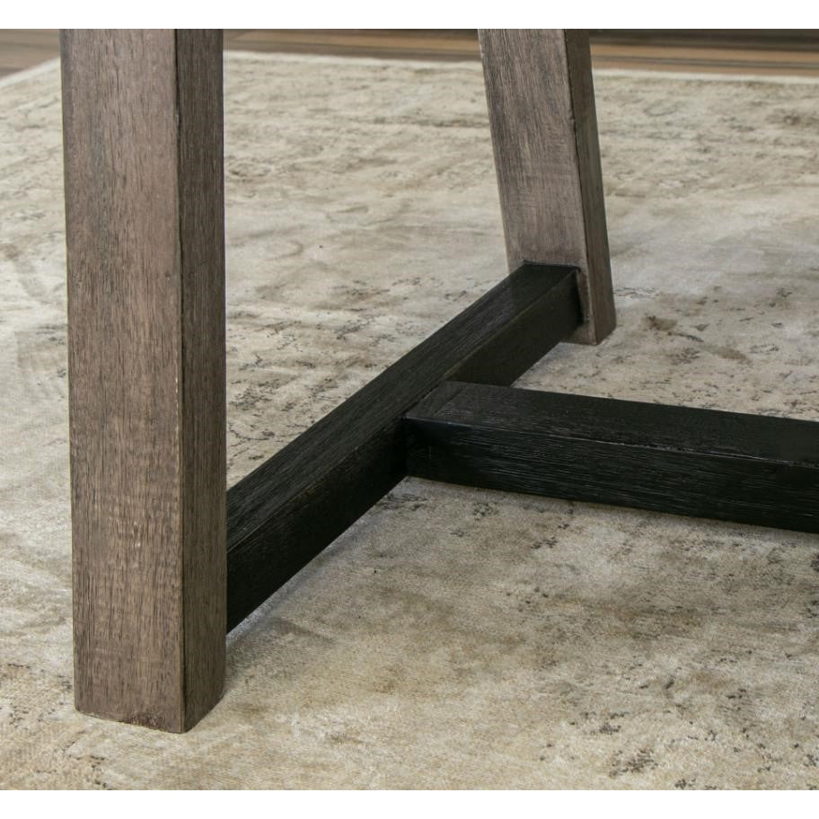 Table legs on a textured beige rug.