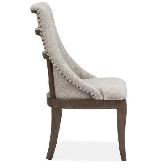 Elegant chair with a curved back and nailhead trim.