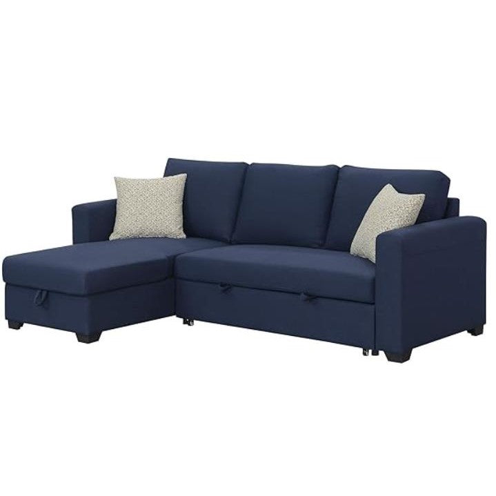 Navy blue sectional sofa with two beige pillows.