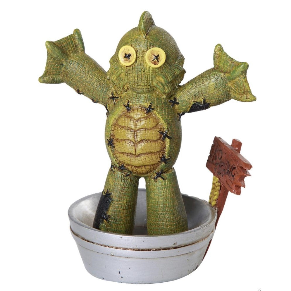 Green stitched creature in a bowl with a "No Fishing" sign.
