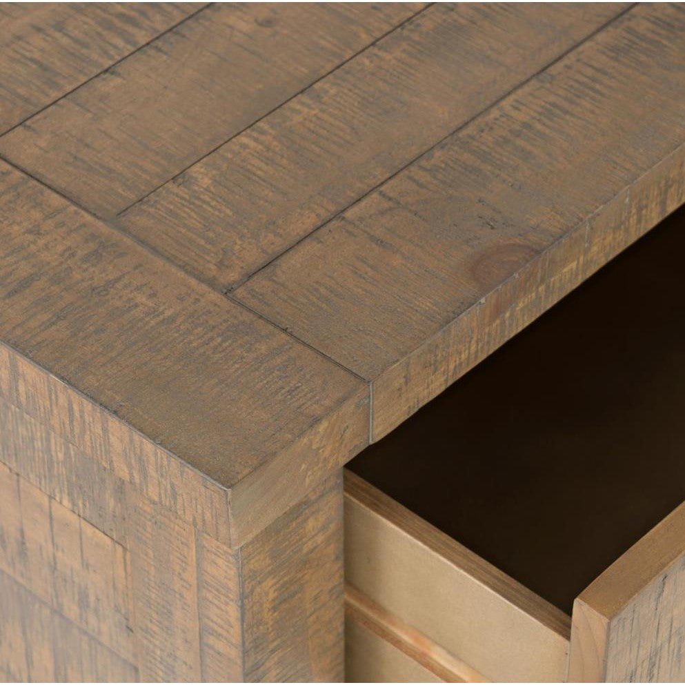 Wooden drawer corner with open drawer.