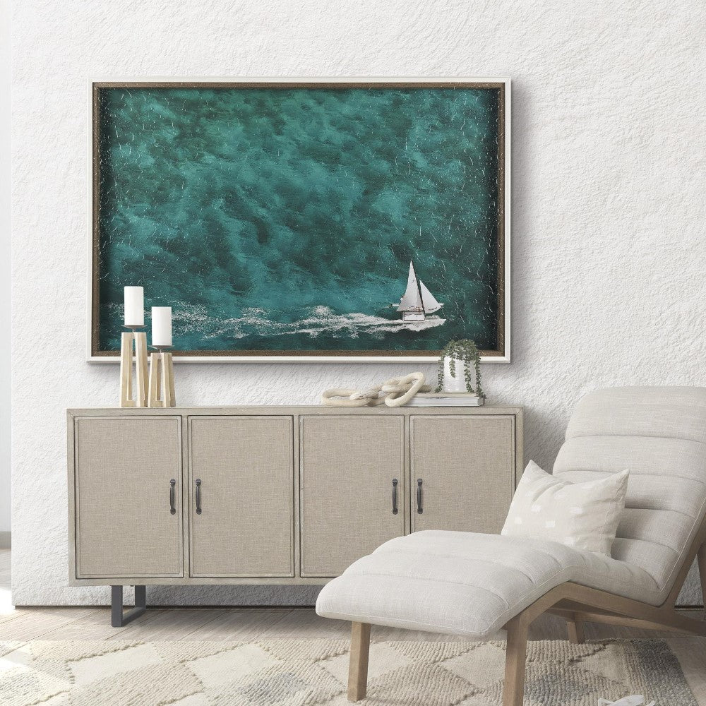 Coastal room decor with a sailboat painting and modern beige furniture.