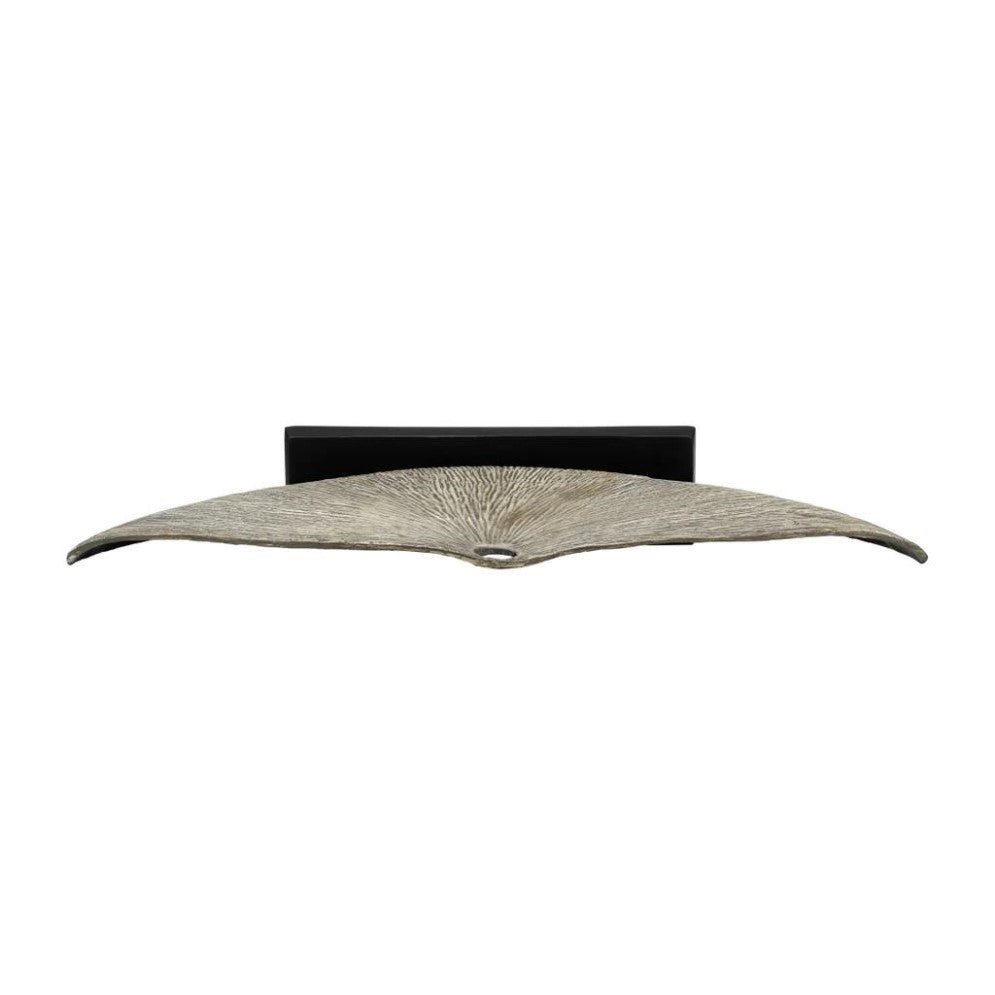 Curved metallic wall sconce with a textured design.