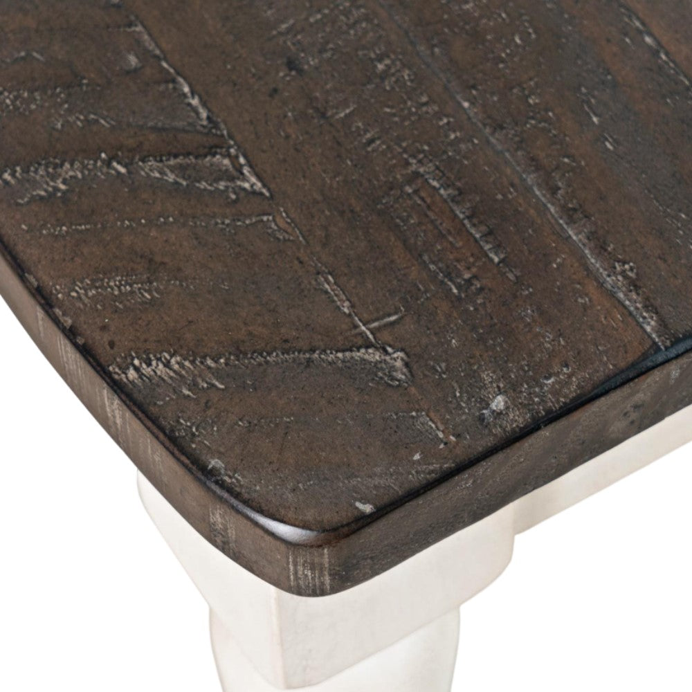 Dark wooden tabletop with a textured surface and white legs.