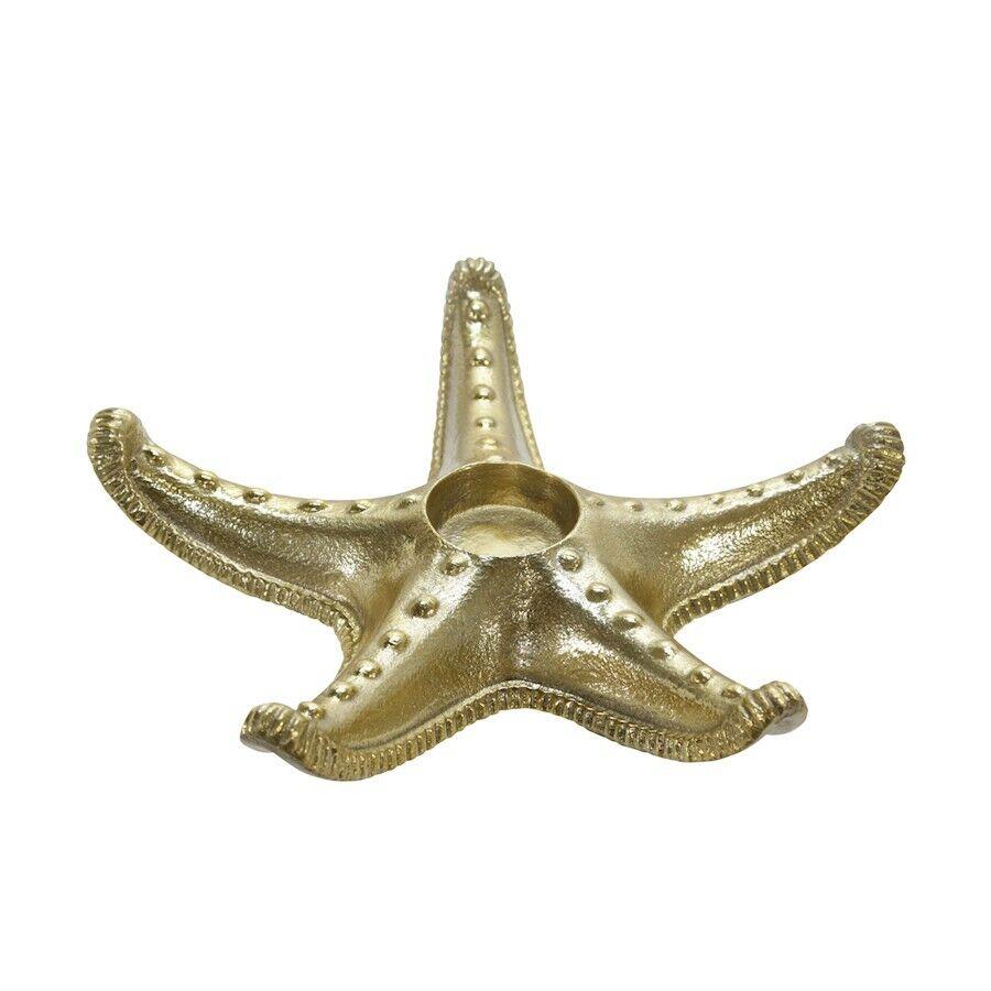 Gold starfish-shaped candle holder with textured details.