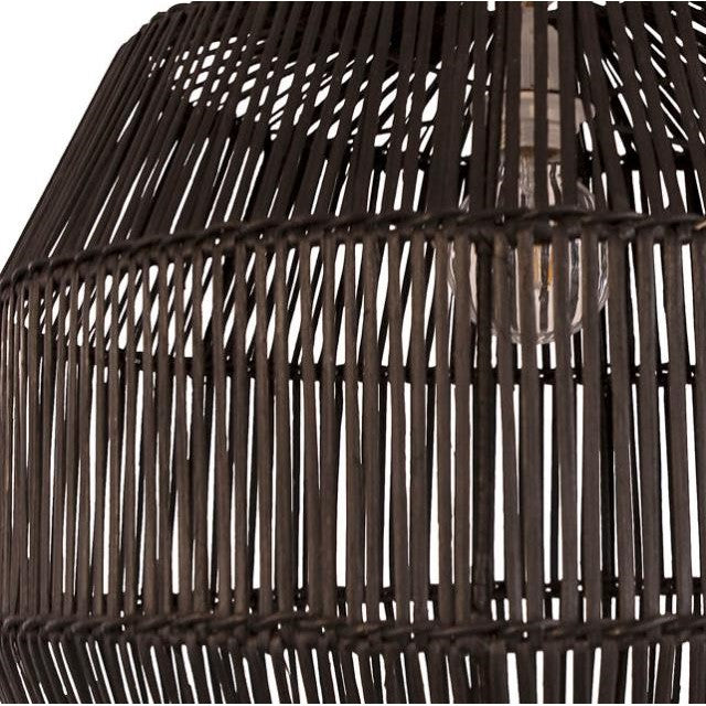Woven bamboo lampshade with visible bulb inside.