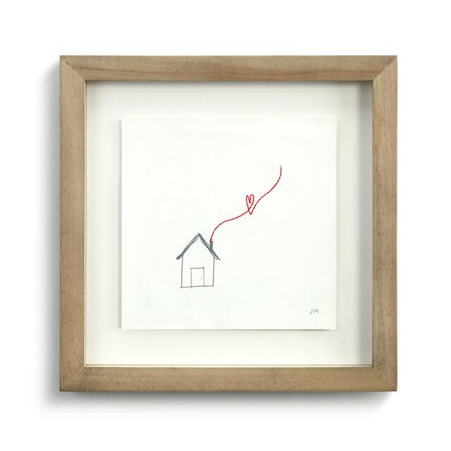 Framed sketch of a house with a red line forming a heart above it.