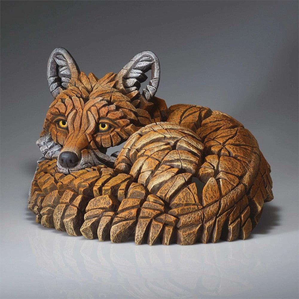 Geometric fox sculpture with intricate wood-like texture.