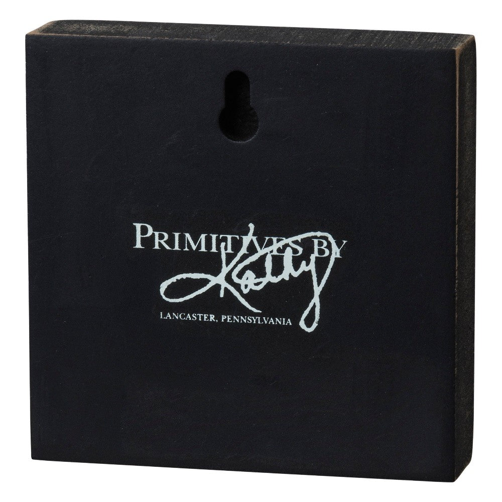 Black sign with "Primitives by Kathy" logo and a hanging slot.