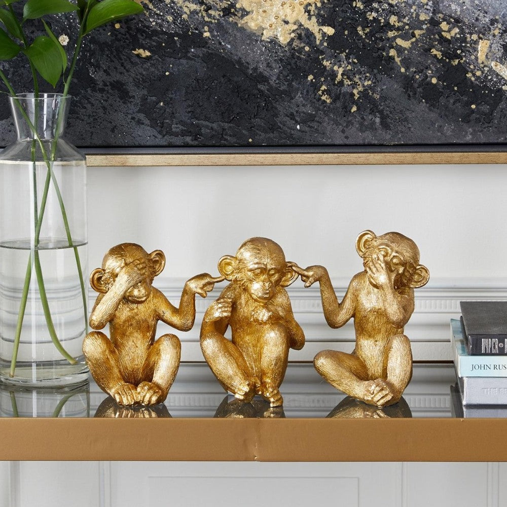 Three gold monkey statues: see no evil, hear no evil, speak no evil.