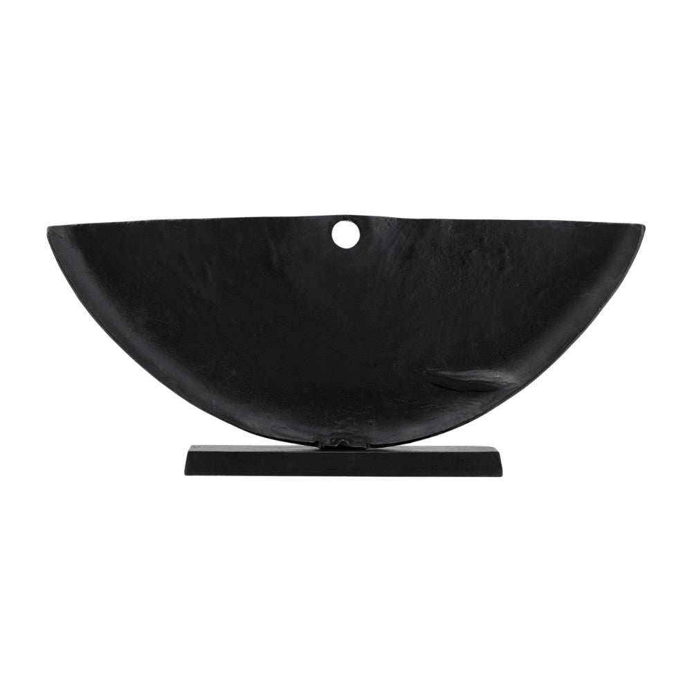 Abstract wing-like metallic sculpture with textured surface.