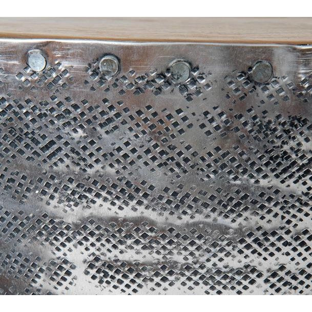 Metal surface with a grid pattern and round rivets.