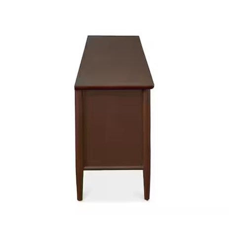 Side view of a dark brown wooden desk against a white background.