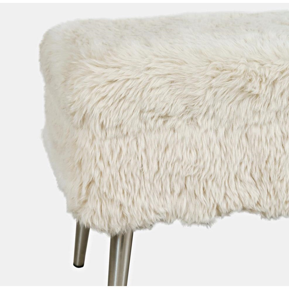 Fuzzy white stool with metal legs.