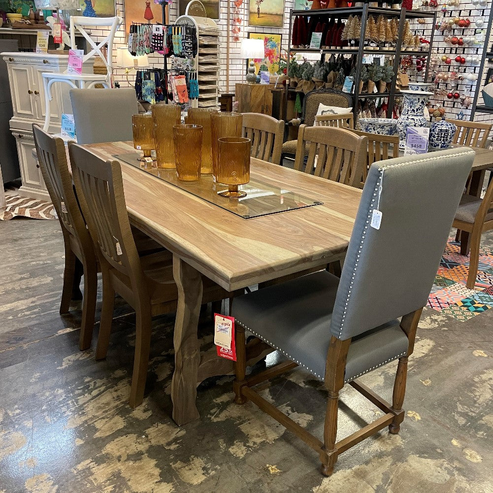 Wooden dining table set in a decorated store.