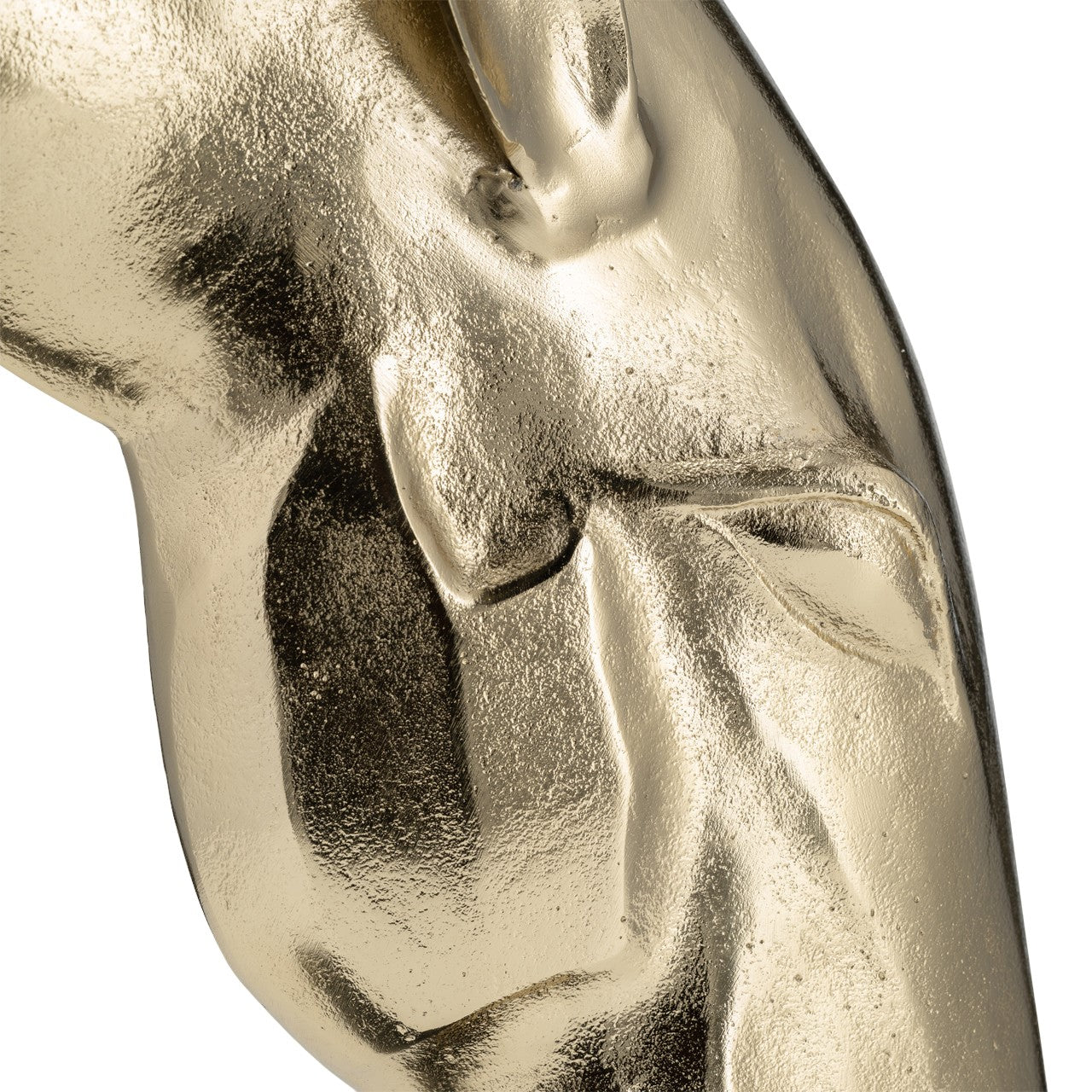 Close-up of a shiny, textured golden object.