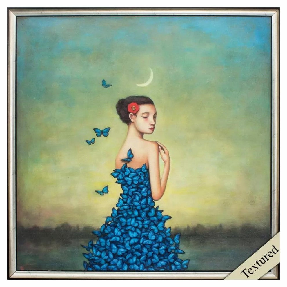 Woman in a blue butterfly dress with crescent moon backdrop.