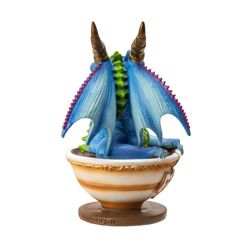 Blue dragon figure in a bowl with ornate details.