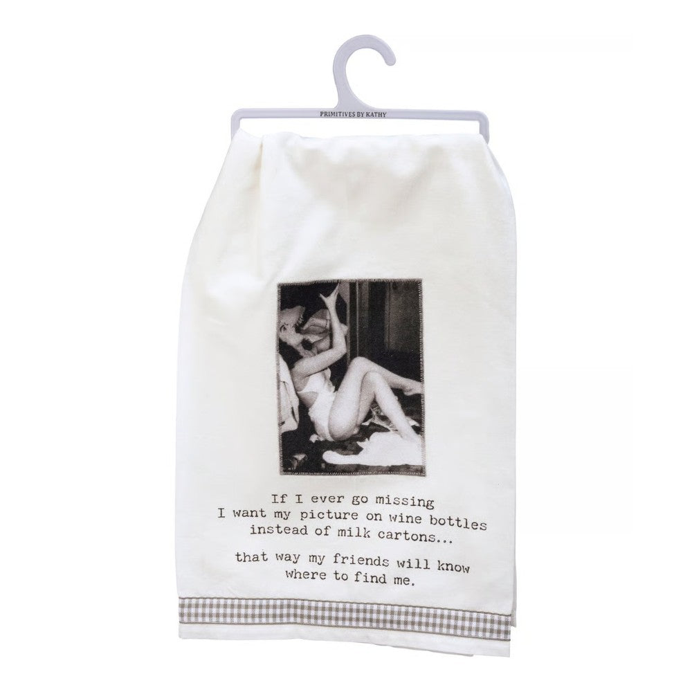 White towel with humorous quote about being found on wine bottles.