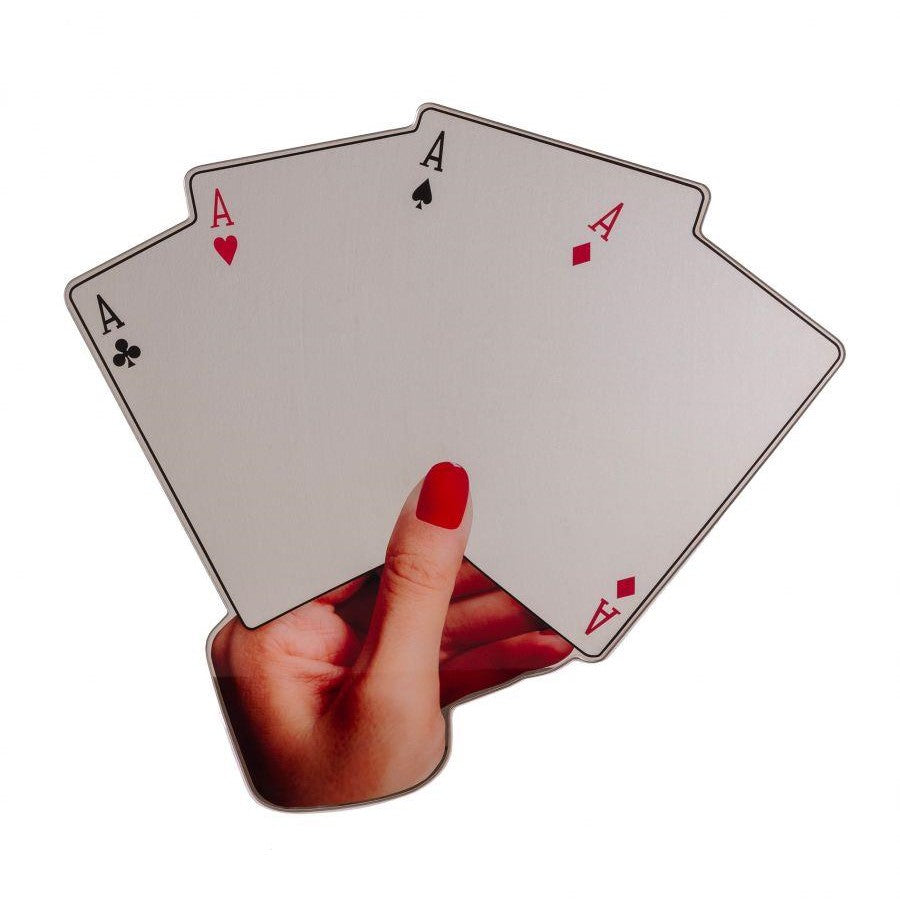 Hand holding four aces, painted nails.