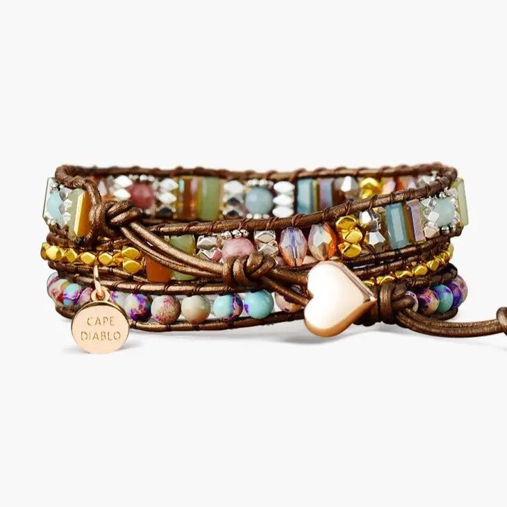 Colorful beaded bracelet with metal charm and heart clasp.