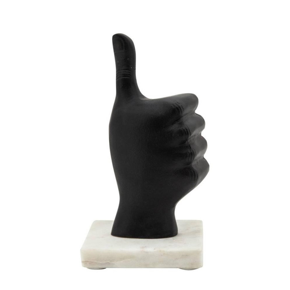 Black thumbs-up sculpture on a white base.