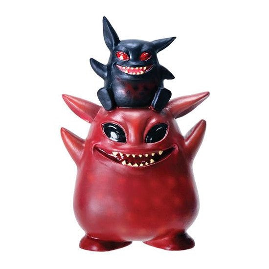 Two quirky, grinning creatures stacked atop each other.