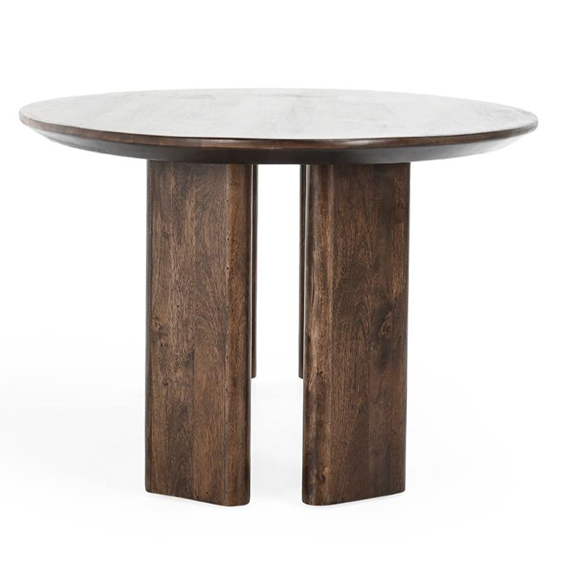 Round wooden table with unique block legs.