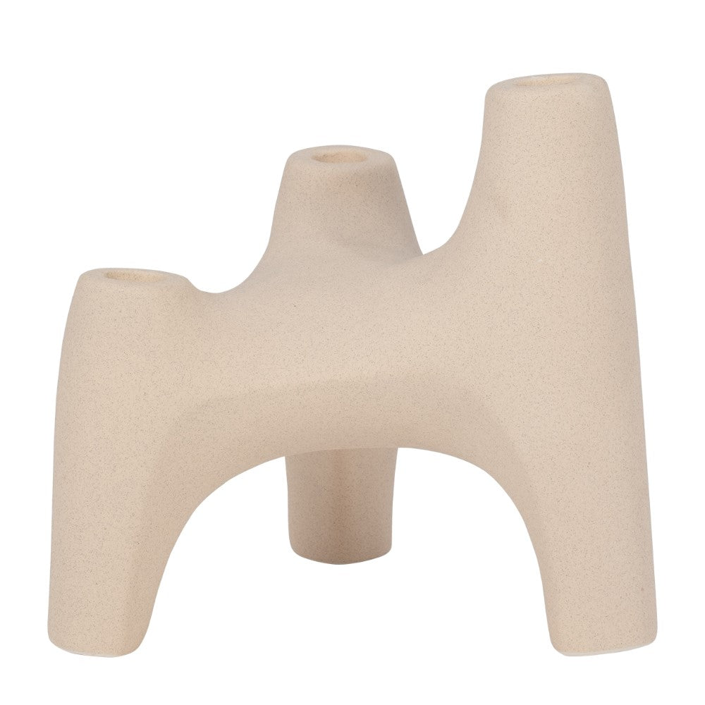 Beige, abstract candle holder with three legs and four openings.