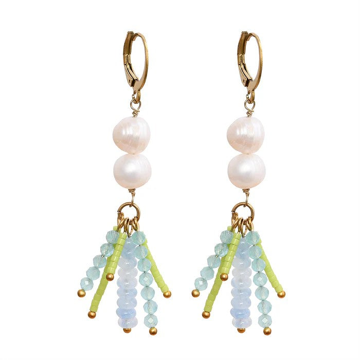 Dangling pearl earrings with colorful bead accents.