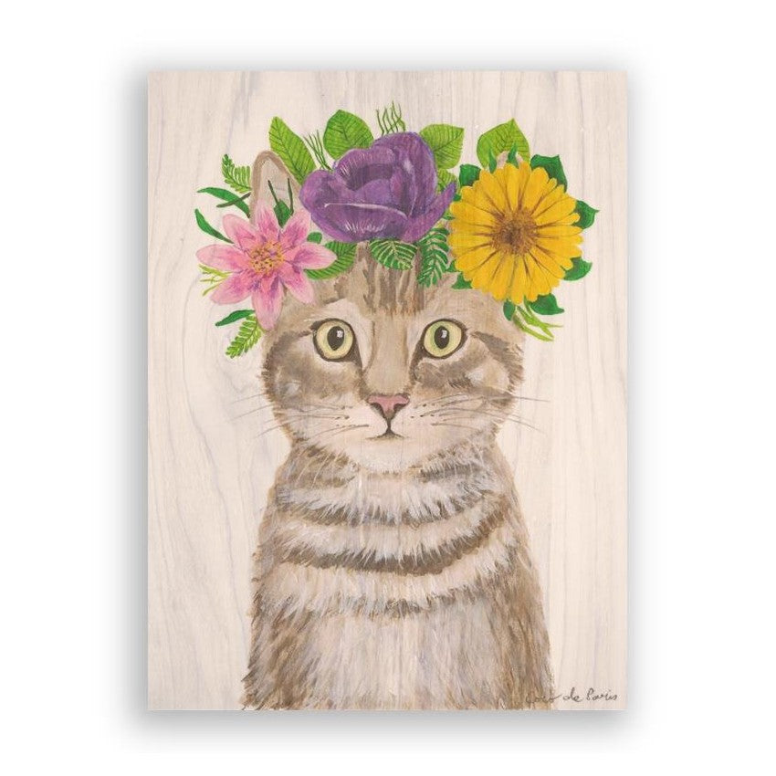 Cat with colorful flower crown on wooden background.