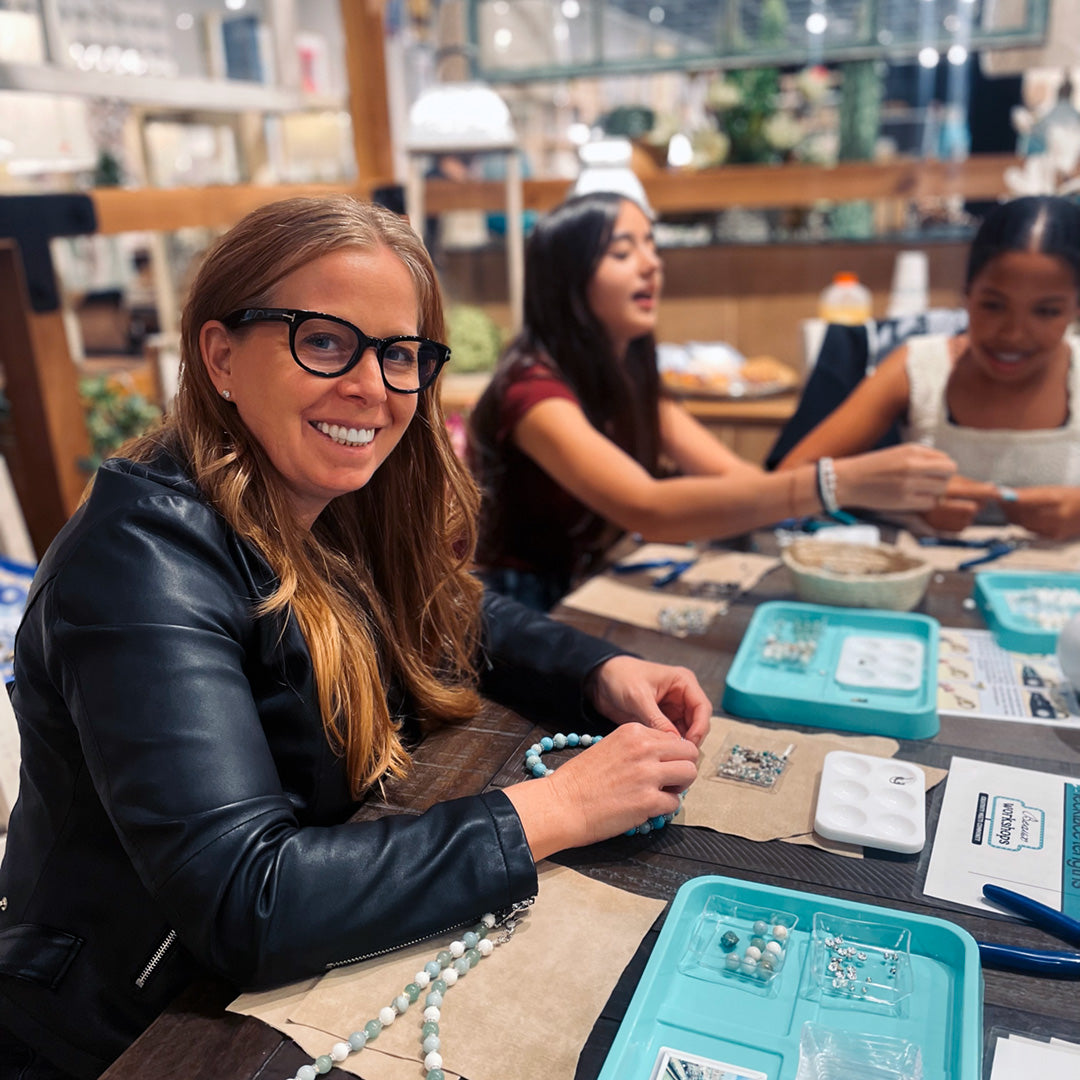 Smiling participant at a jewelry workshop