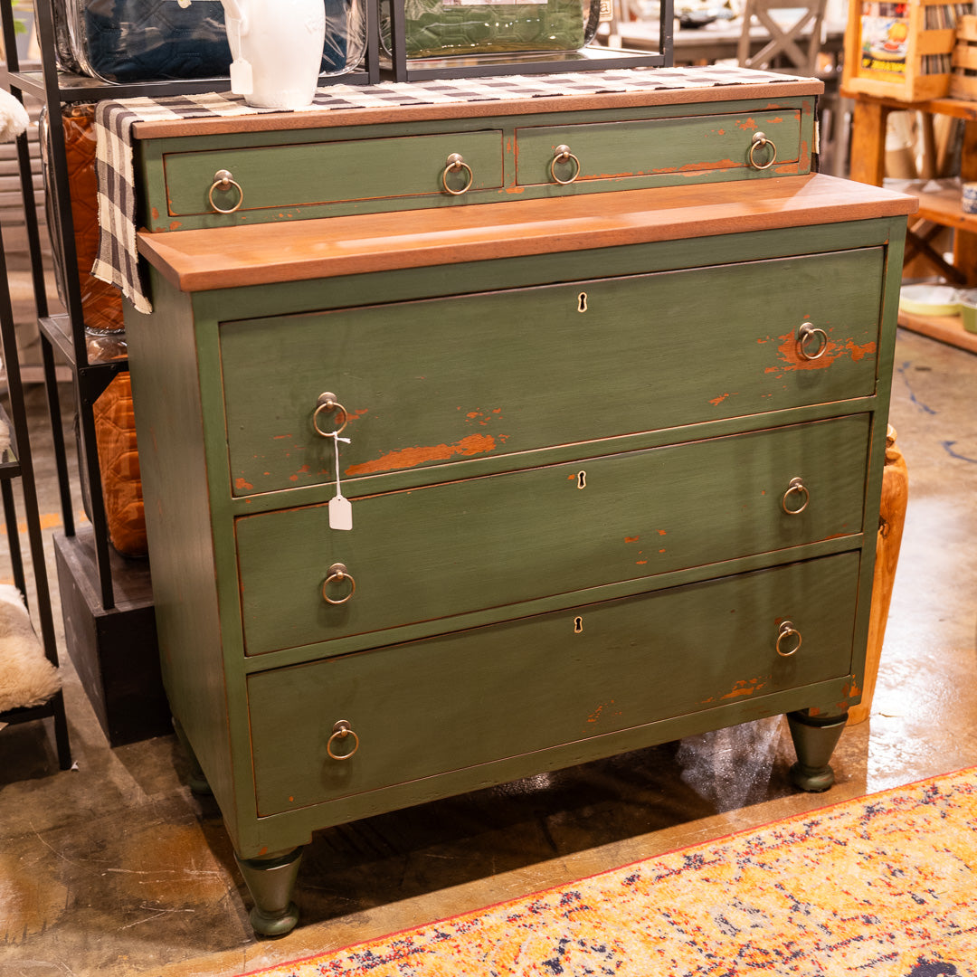 A hand-painted, refurbished green dresser