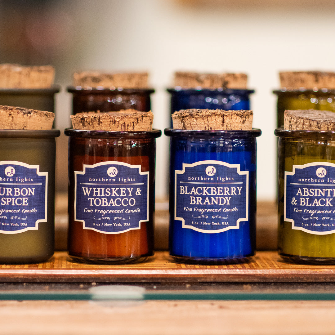 Scented liquor-themed candles with cork lids
