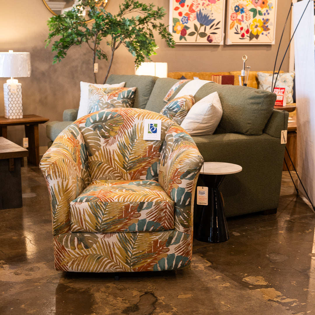 A custom made swivel chair in a striking, tropical fabric