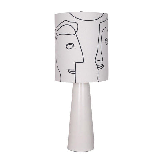 Modern lamp with abstract face design on the shade.