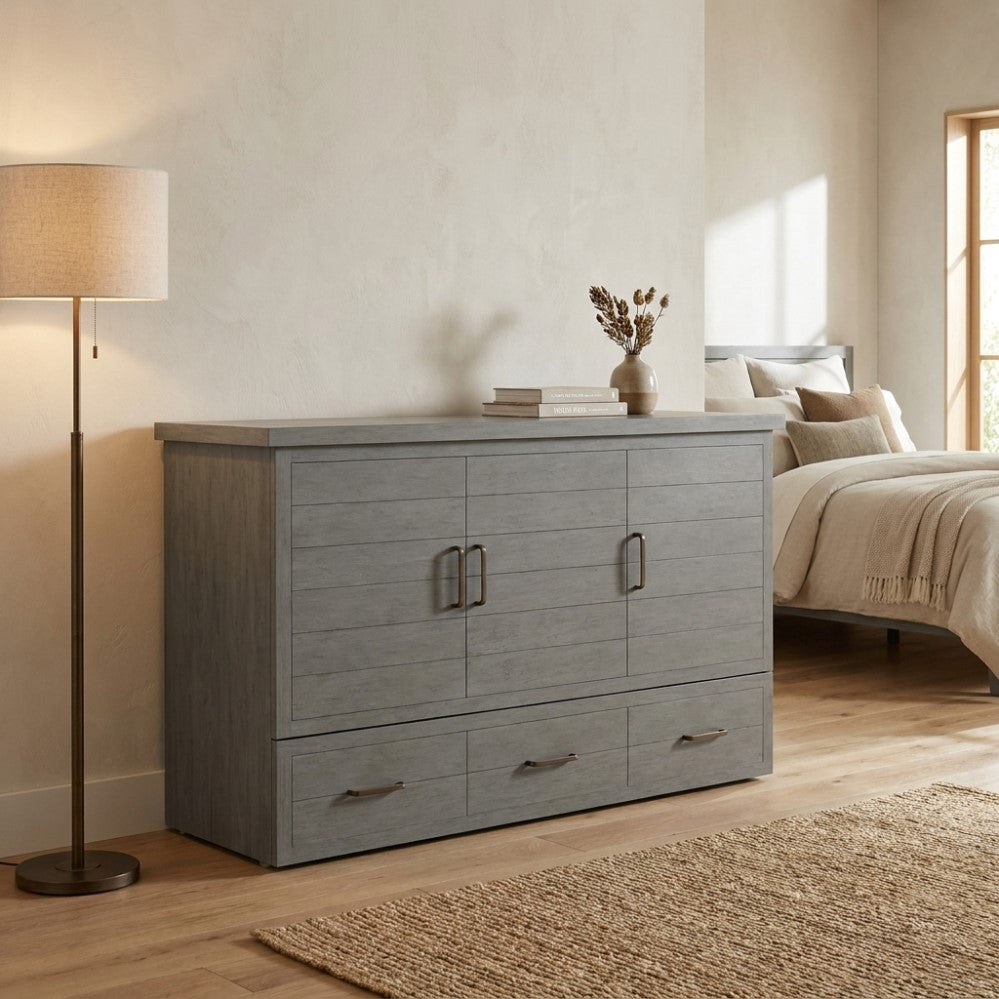 Modern bedroom with gray cabinet, cozy bed, lamp, and decor by the window.