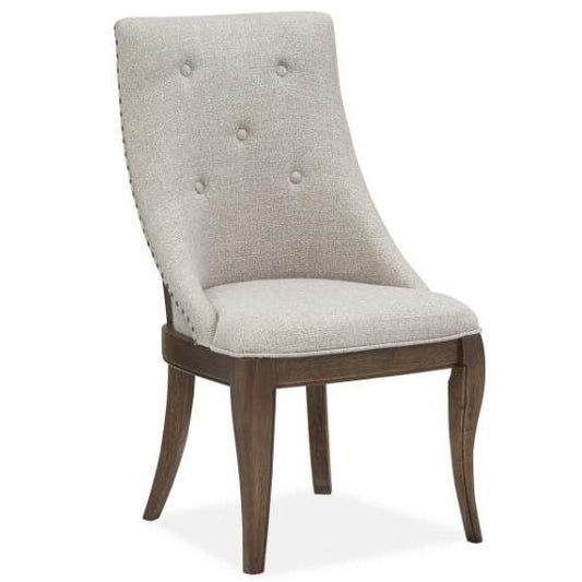 Elegant chair with padded beige back and wooden legs.