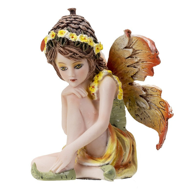 Seated fairy figure with orange wings and flower headdress.