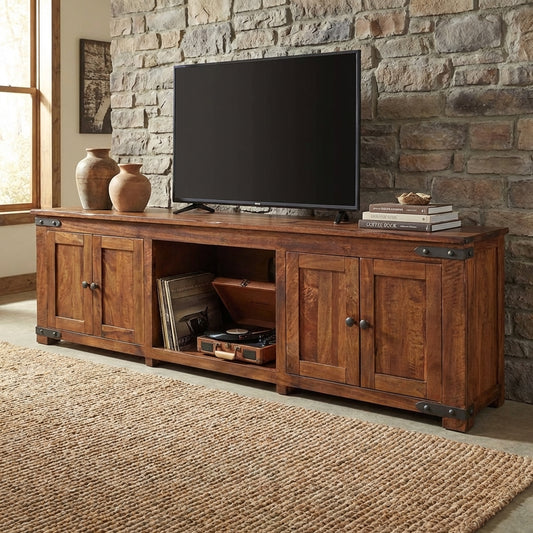 Wooden TV stand with cabinets and shelves, metal accents.