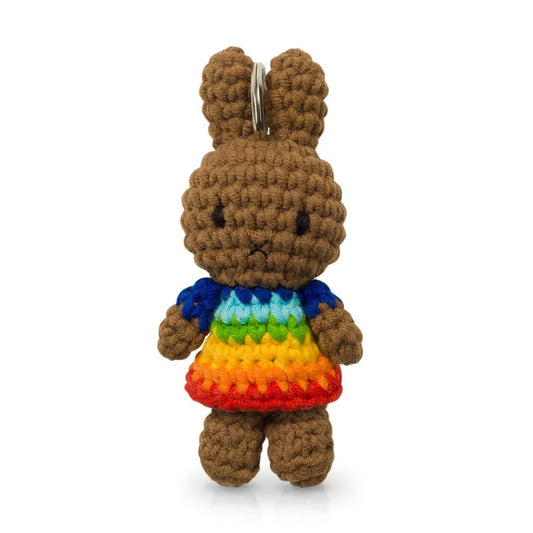 Crocheted bunny keychain wearing rainbow dress.