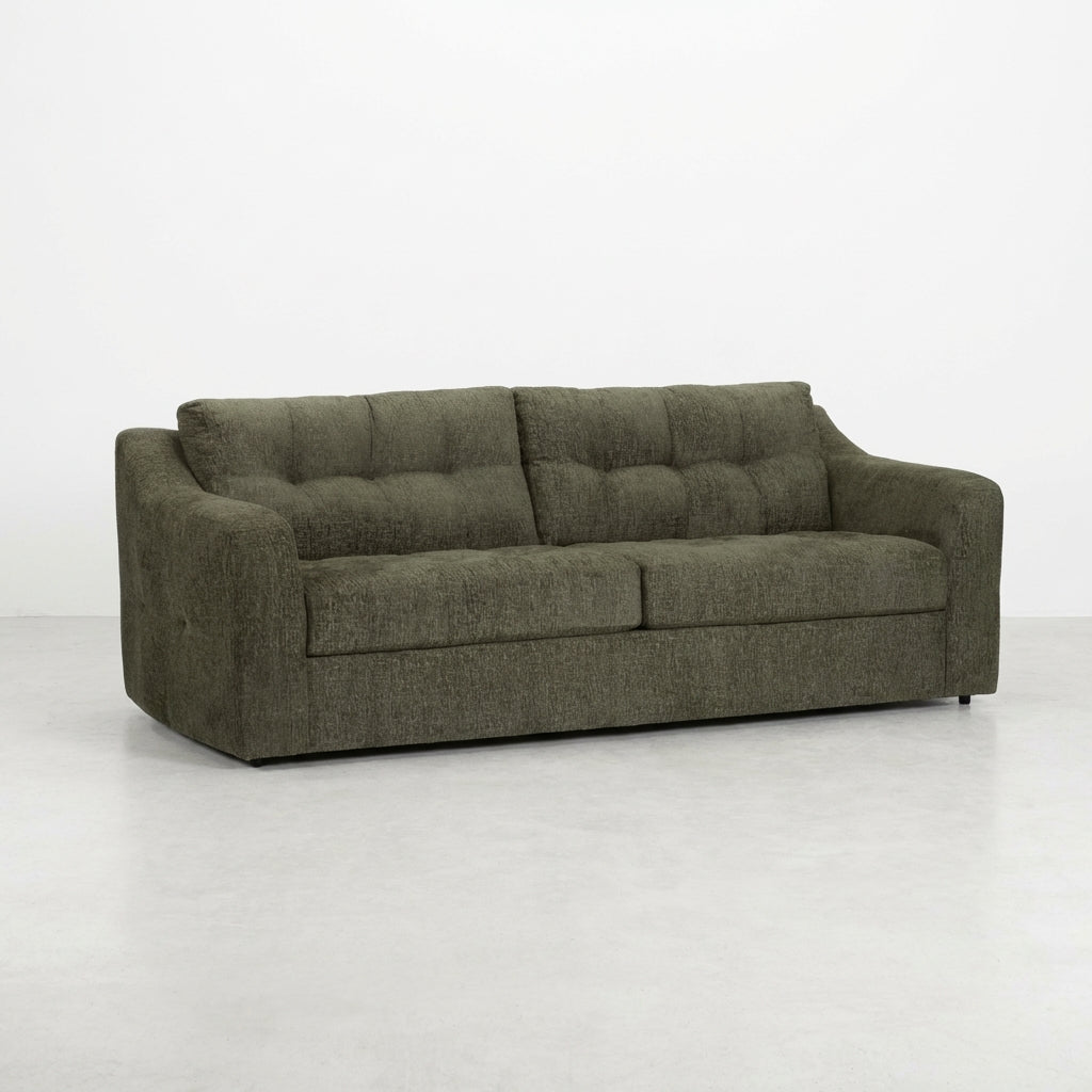 Dark gray tufted sofa with wide armrests.