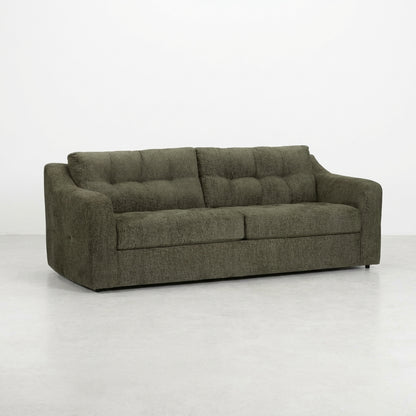 Dark gray tufted sofa with wide armrests.