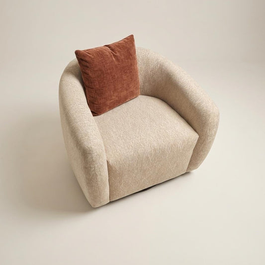 Cream-colored, curved armchair with a cozy, plush texture.