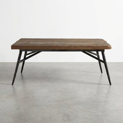 Rustic wooden table with metal legs, minimalist design.
