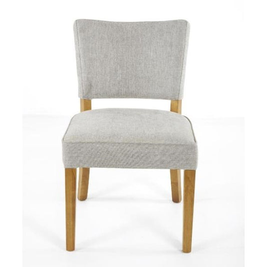 Gray upholstered chair with wooden legs.