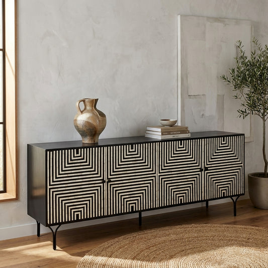 Black sideboard with geometric pattern doors and elegant thin legs.