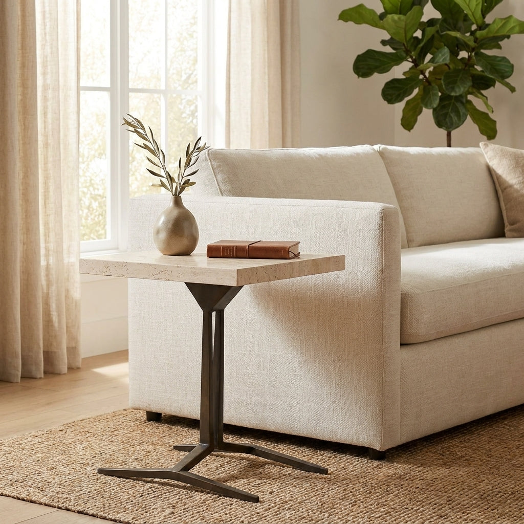Minimalist living room with sofa, side table, and plant.